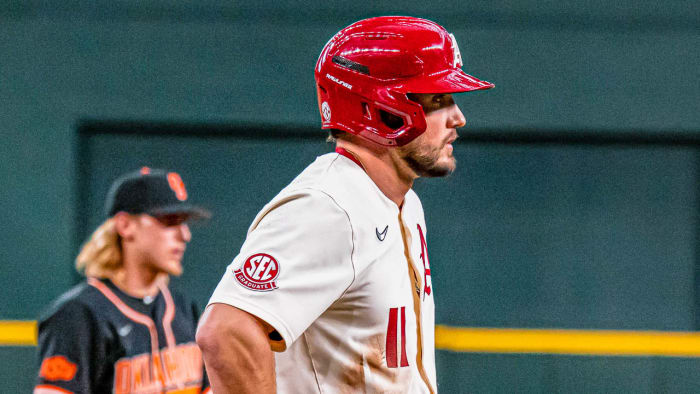 Arkansas Razorbacks outfielder Jared Wegner on base again in Sunday's game with Oklahoma State on Sunday.